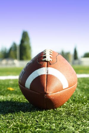An american football on a football fieldの写真素材