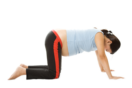 A shot of a pregnant woman exercisingの写真素材
