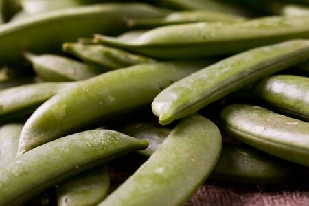 A closeup shot of a bunch of green peas