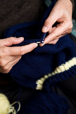 A shot of a senior asian woman knitting