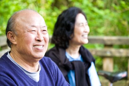 A shot of a couple of happy asian senior outdoorの写真素材