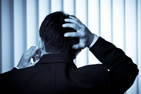 A shot of a stressed businessman talking on the phone