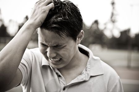 A sad and stressed young asian male in black and whiteの写真素材