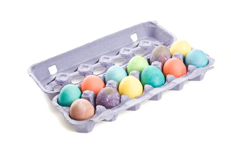 A shot of colorful easter eggs in a carton