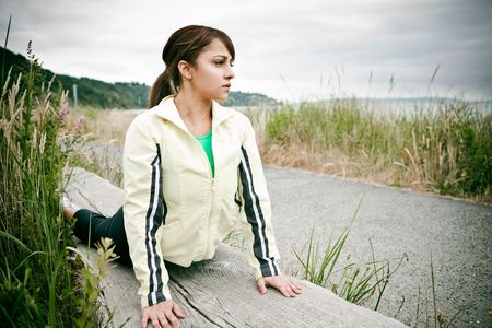 A beautiful asian woman exercises in a parkの写真素材