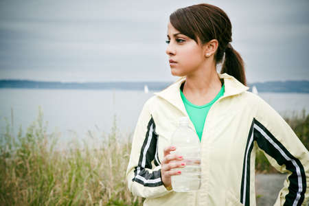 A beautiful asian woman exercises in a parkの写真素材