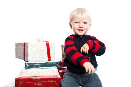 A caucasian boy with a lot of christmas giftの写真素材