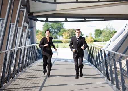 A shot of two business people running competing against each otherの写真素材
