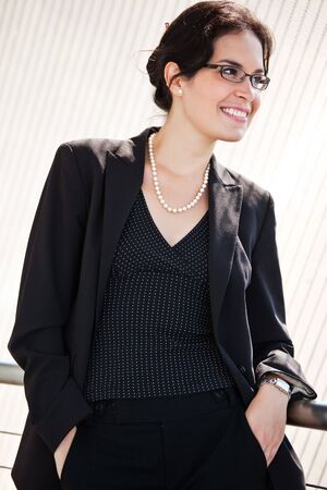 A portrait of a hispanic businesswoman outdoorの写真素材