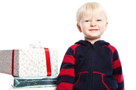 A caucasian boy with a lot of christmas giftの写真素材