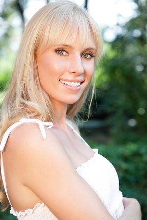 A portrait of a happy beautiful caucasian girl outdoorの写真素材