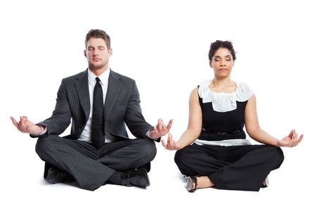 An isolated shot of a black  businesswoman and a caucasian businessman doing meditationの写真素材