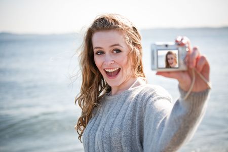 A beautiful caucasian girl outdoor on the beach during summerの写真素材