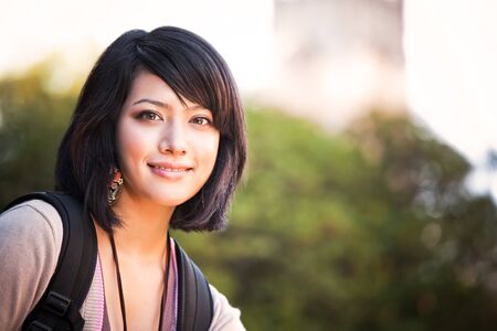 A portrait of a mixed race college student at campusの写真素材