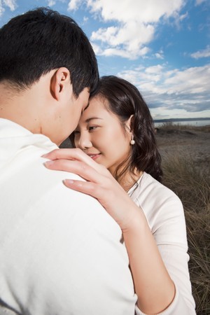 A portrait of an asian couple outdoorの写真素材