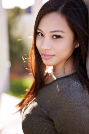 A portrait of a beautiful asian girl outdoorの写真素材