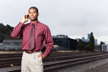 A shot of a black businessman on the phoneの写真素材