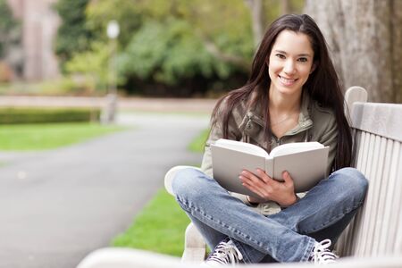 A shot of an ethnic college student studying on campusの写真素材