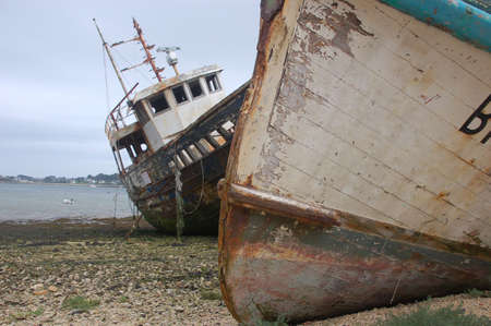 Damages ships in a harbour in Franceの写真素材