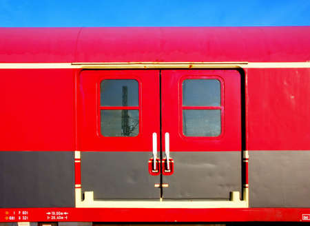 Vintage red cabin with doors and windowsの写真素材