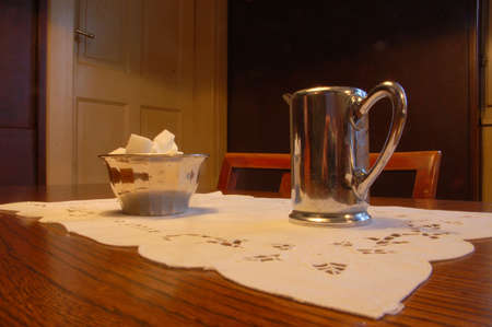 White cup of coffee with milk jug and sugar bowlの写真素材