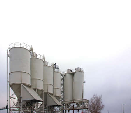 Assembly of silos on an industrial siteの写真素材