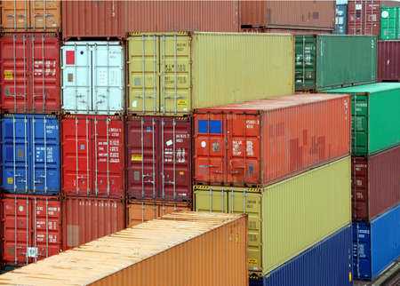 Assembly of cargo container waithing for transportation in a harbor