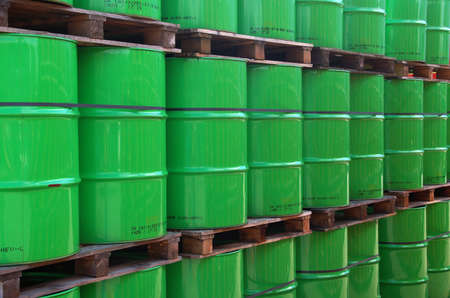Assembly of green oil drums on wooden paletsの写真素材