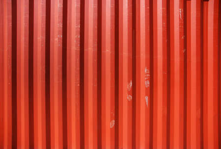 Red profiled metal wall of a cargo containerの写真素材