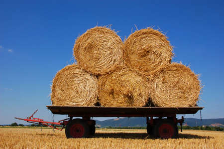 Balls of hay on a agriculture trailorの写真素材