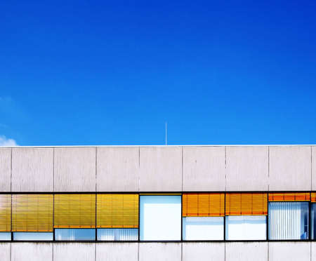 Office building with yellow shutters
