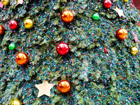 Christmas tree with balls and electric candles