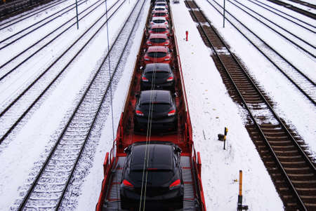 New cars on railroad wagonsの写真素材