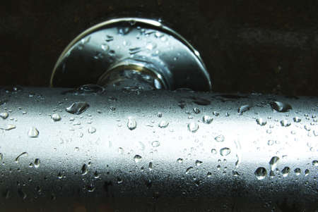 Drops of water on a bathroom control valve