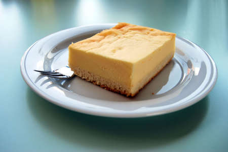 Fresh cheesecake on a white plateの写真素材