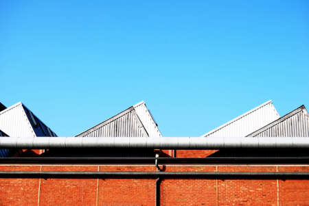 Factory roof on a brickstone buildingの写真素材