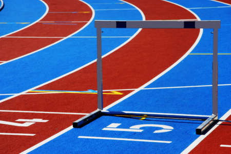 Athletic track with numbers and hurdle
