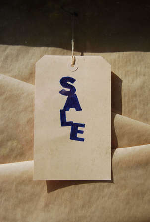 Sale sign on brown paperの写真素材