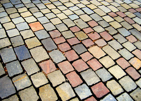 Colorful pattern of cobblestone on a street pavementの写真素材