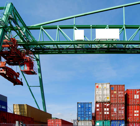 Cargo container and a huge crane in a harbourの写真素材