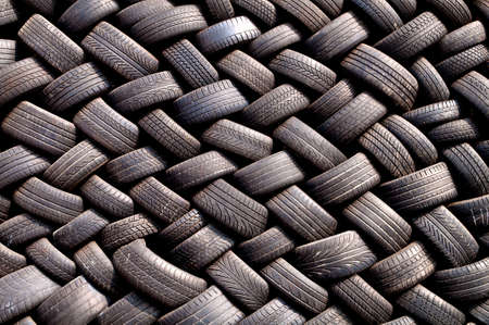Stack of old tires in a garageの写真素材