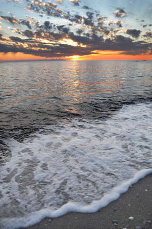 Sundown on the water of the mediterranean seaの写真素材