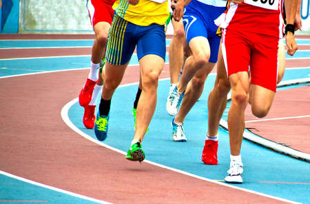 Men on an athleteic track during a long runのeditorial素材