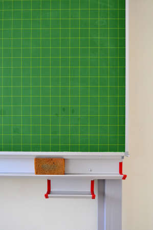 Detail of a green blackboard with sponge in a schoolの写真素材