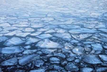 Plates of ice floating on a riverの写真素材