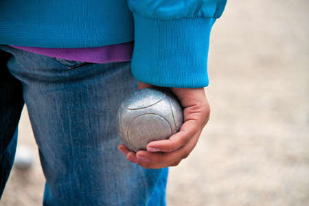 Boule ball in the hand of a womanの写真素材