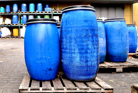 Blue plastic chemical drums in a chemical storage