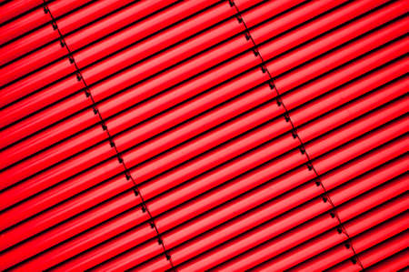 Vertical shutter blind in a factory windowの写真素材