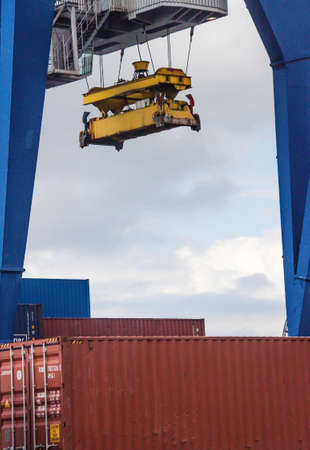 Big harbour crane on a cargo container storage siteのeditorial素材