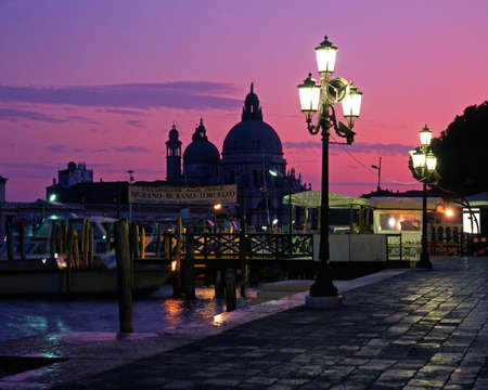 Quayside and church of Santa Maria Della Salute at sunset, Venice, Veneto, Italy, Europe の写真素材